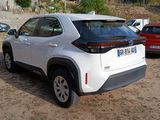 a white toyota rav parked in a parking lot