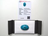 a picture of a business card and a stone on a wall