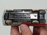 a person holding a toy train that is in their hand