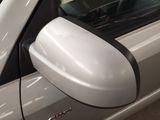 a close up of a car ' s side mirror and door handle