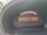 a close up of a car ' s dashboard with a speedometer