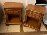 two wooden tables sitting next to each other on the floor