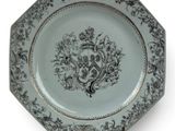 a plate with a design on it on a stand