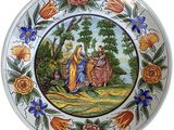 a plate with a picture of a woman and a man riding a horse