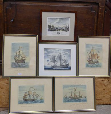 four framed pictures of ships are on display in a room