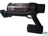 an image of a black gun with a red light