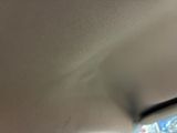 a view of a car ' s rear view mirror from the inside