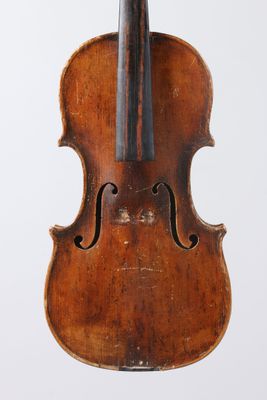 an old violin with a wooden back and bow on a white background