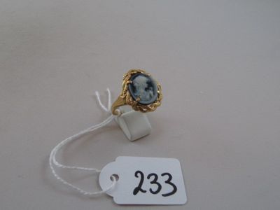 a ring with a picture of a woman on it and a price tag