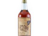 a bottle of old fashioned whiskey on a white background