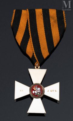 l'image d'une médaille sur laquelle figure une croix au recto