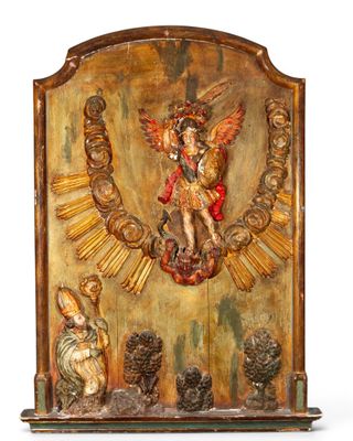 an old wooden plaque with a statue of an angel on it