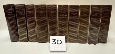 six old books are lined up in a row with a number 30 on them