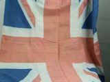 a union jack flag on a blanket on a chair