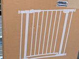 a cardboard box with a picture of a baby gate on top of it
