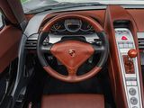 the interior of a sports car with a steering wheel and dashboard
