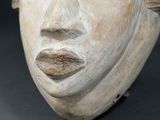 a close up of a carved head of a woman