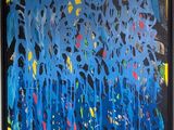 abstract painting of blue, yellow, and red paint on a black background