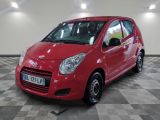 a picture of a red car parked in a garage