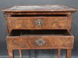 an old wooden table with two drawers on top of it