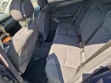 the back seats of a car with a remote control in it