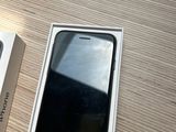 a box with a phone inside of it on a table
