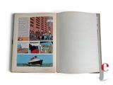 an open book with a picture of a boat on it