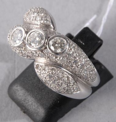 an image of a silver ring with three stones on top of it