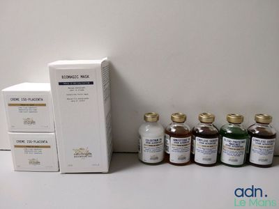 bottles of liquid and a box of medicine sitting on a table