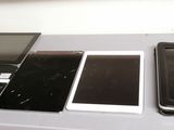three different types of electronic devices sitting on a table