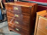 a dresser and a chest of drawers in a room