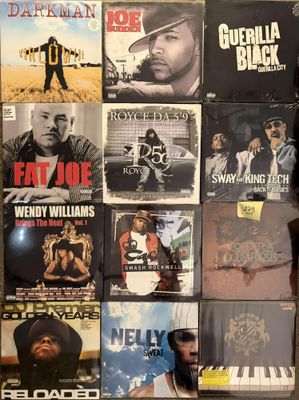 a lot of music cds on the wall in the room