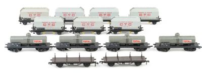 a lot of train cars that are lined up on the tracks