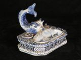 a small blue and white box with a cat on it