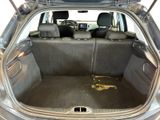 the back of a car with the trunk open and the seats down