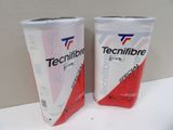 two cups of tecnifibre are sitting on a table