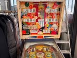 a pinball machine that is on display in a room