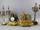 a lot of different types of clocks on the table