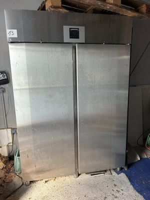 an image of a stainless steel refrigerator in a room