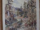 aquarelle encadrée représentant un ruisseau de montagne dans une zone boisée