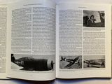 an open book with a picture of a plane on it