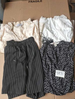 three pieces of clothing in a box on a table