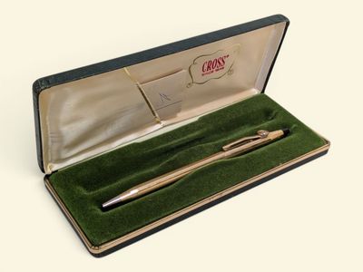a pen in a case that is open on a table