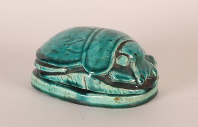 turquoise glazed figurine of a beetle on a leaf
