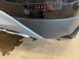 a close up of a motorcycle with a sticker on the back of it