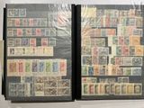 two books with stamps on them sitting on a table