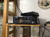 a shelf that has a stereo system on top of it