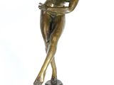bronze statue of a woman on a pedestal with her arms outstretched