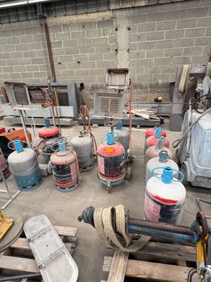 a lot of gas cans and other items in a warehouse