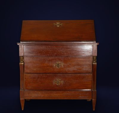 an antique wooden chest of drawers with brass handles